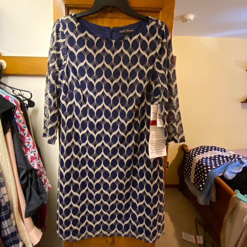 Navy blue/cream pattern short dress with long sleeve.